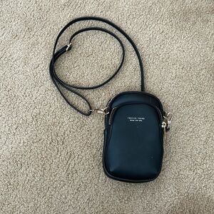 Black small body bag. Adjustable strap